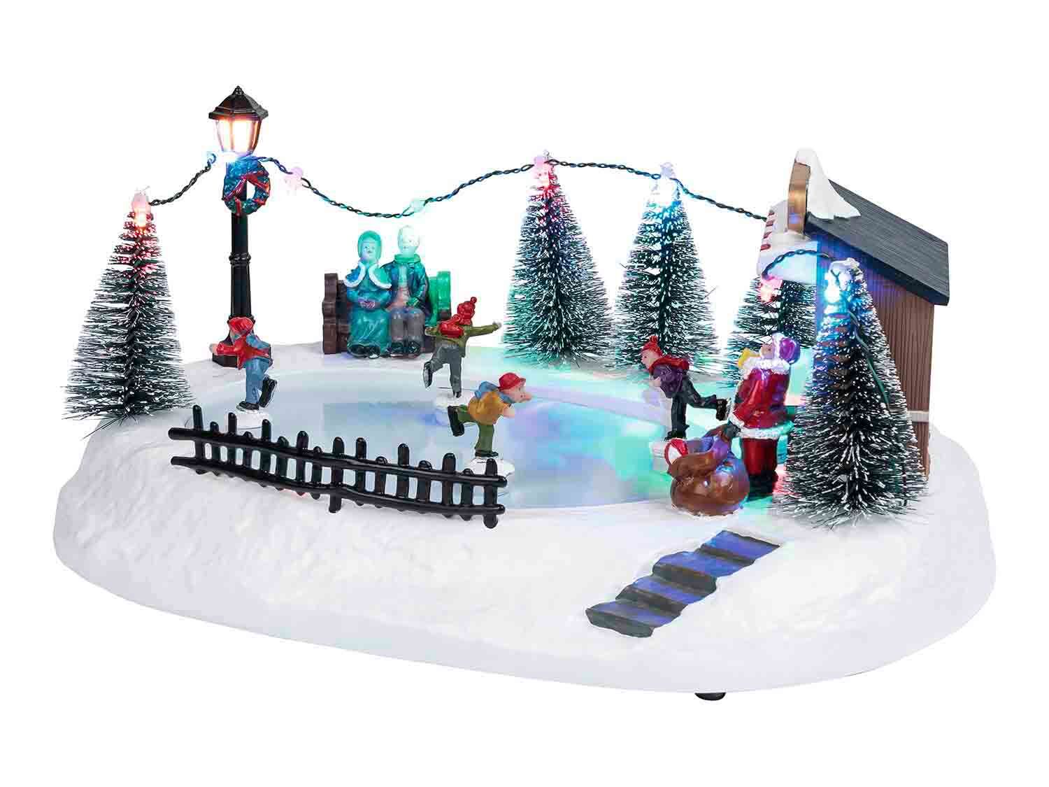 Pueblo navideño con 11 LEDS con pista de patinaje
